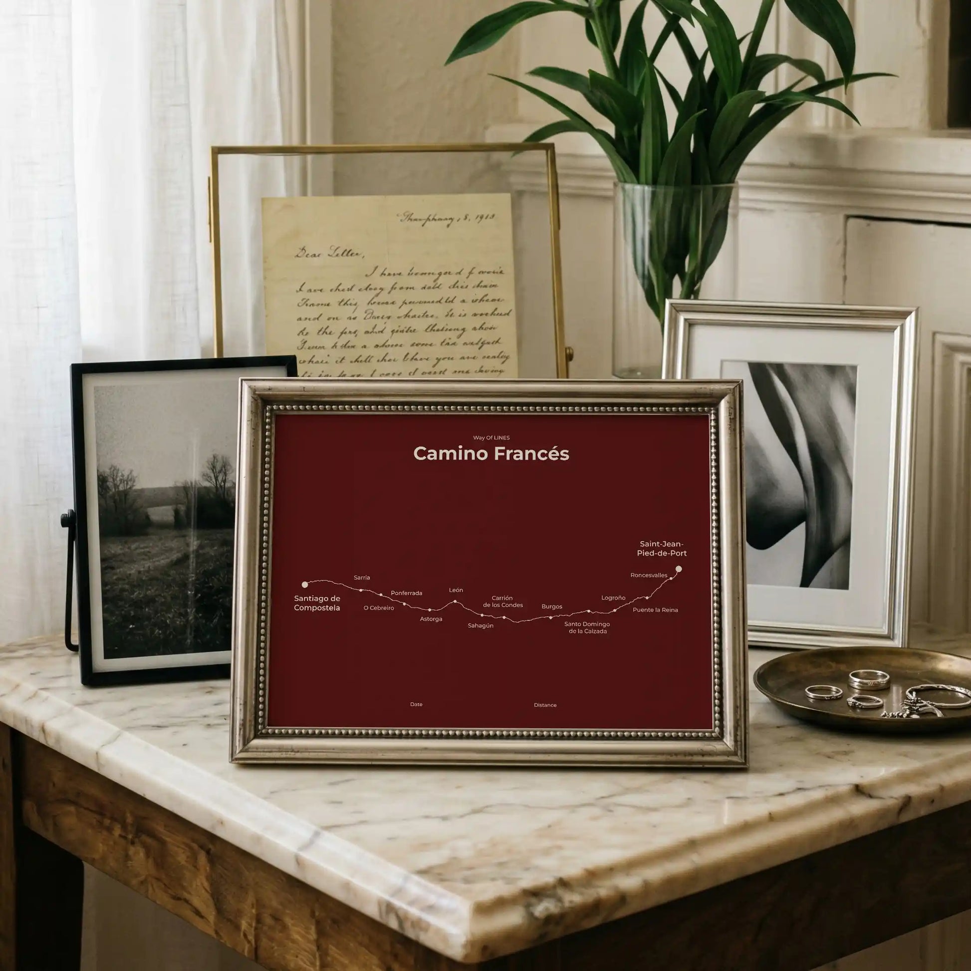Minimalist Camino Francés map poster in reserve red color, interior mockup.
