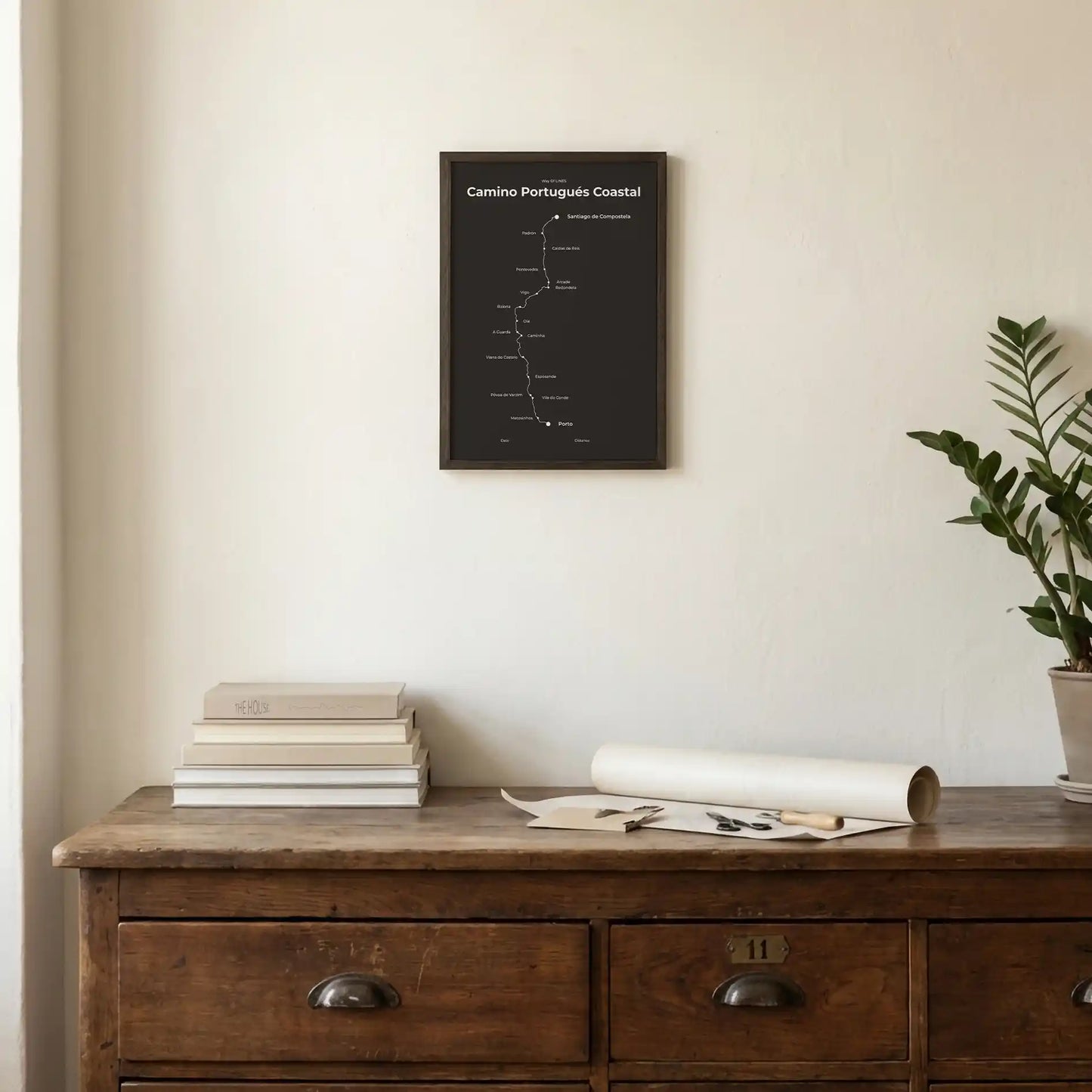 Minimalist Camino Portugués Coastal map poster in deep bark color, interior mockup.

